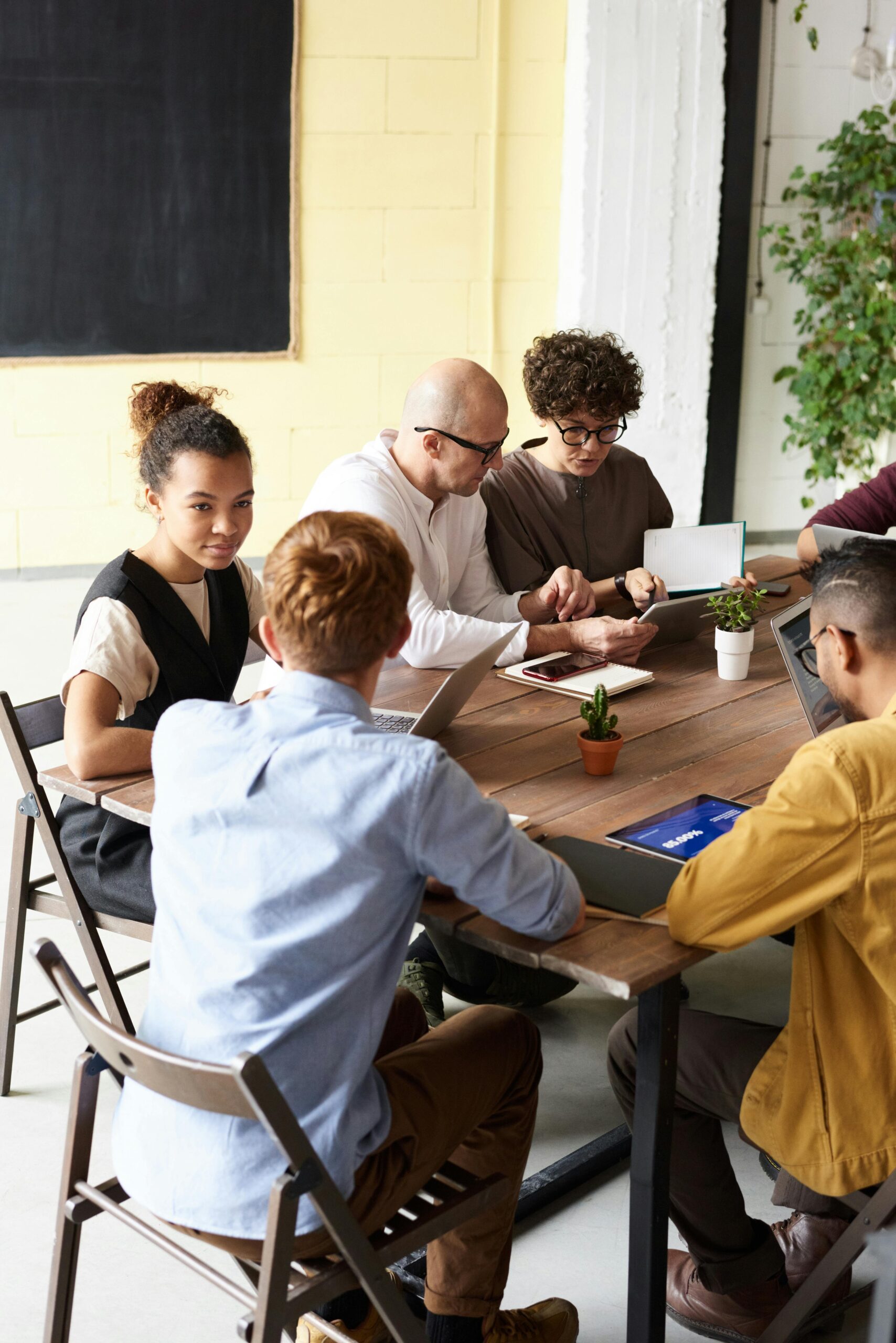 pexels-fauxels-3182785 Mixed grouip holding a business or planning meeting